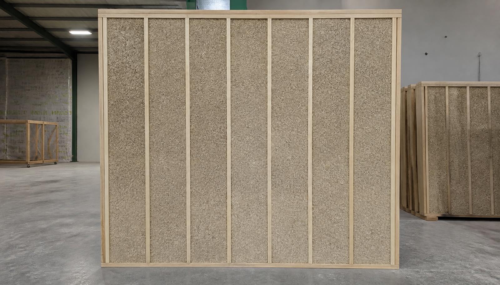 GaiaPanel prefabricated hemp-lime wall panel with wood framing and hemp-lime infill in a fabrication shop
